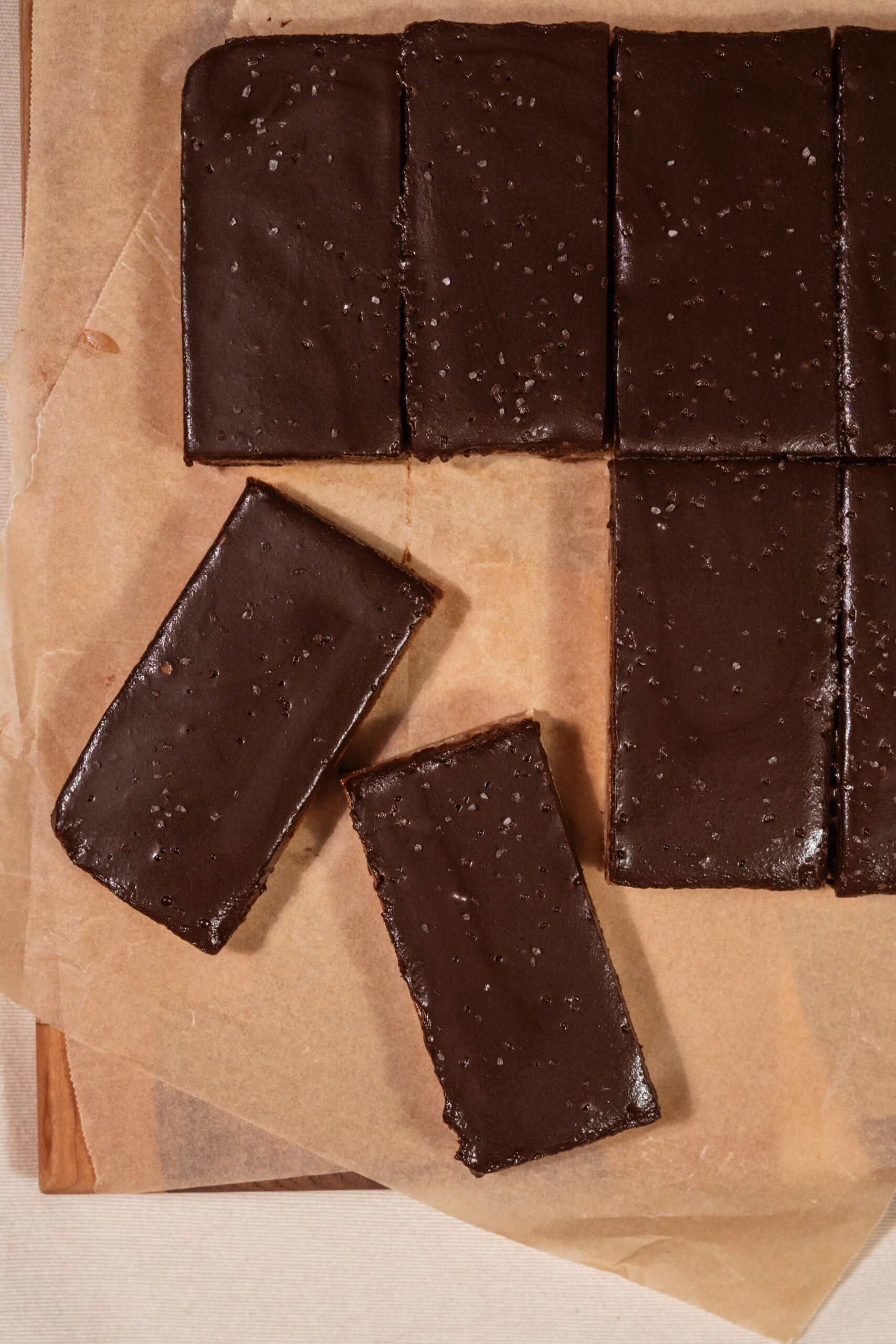 chocolate chip cookie dough bars sliced on parchment paper.