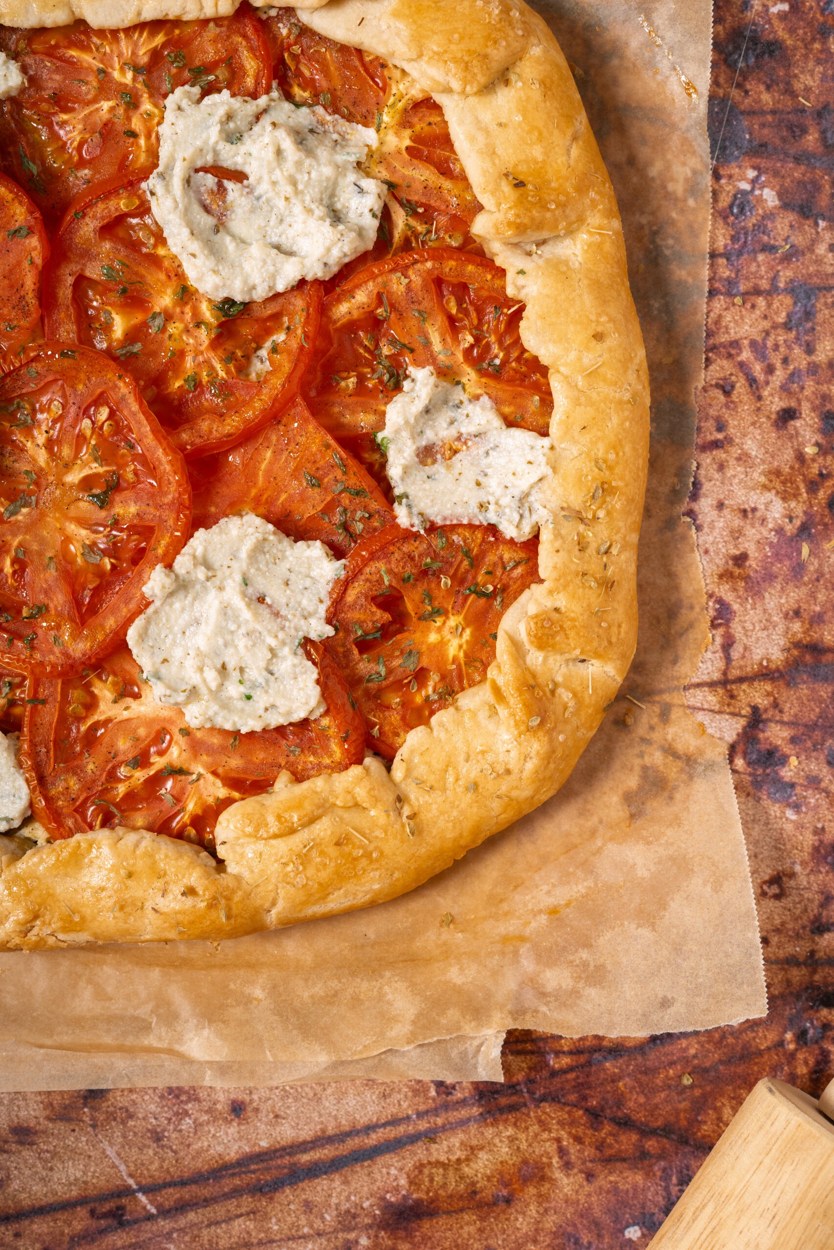 tomato ricotta galette on parchment paper.