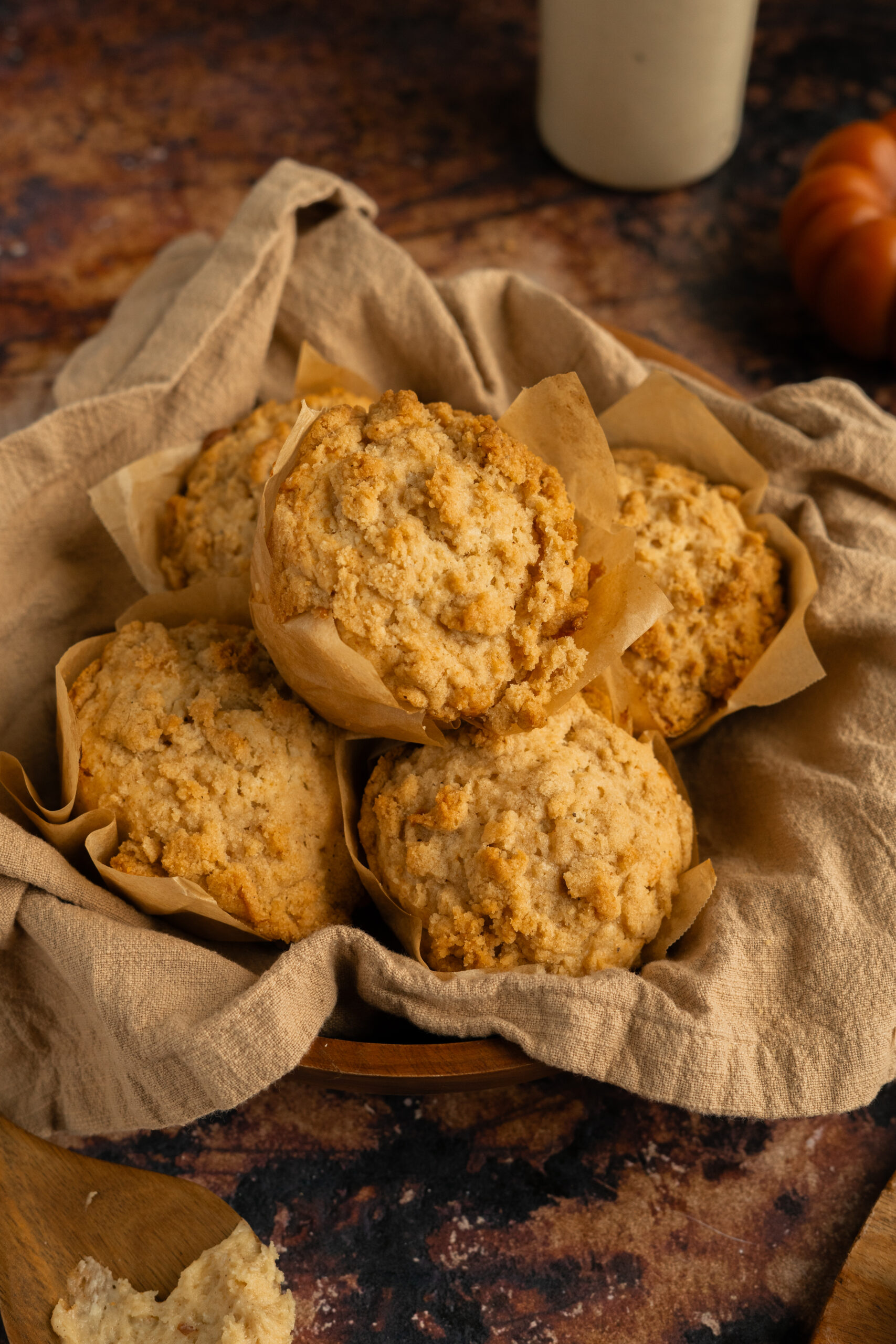 apple muffins in a wooden bowl.