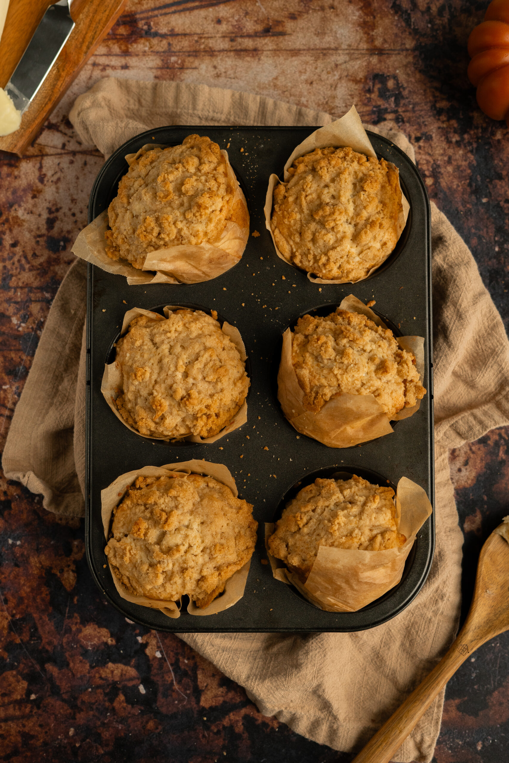 apple muffins in baking tin.