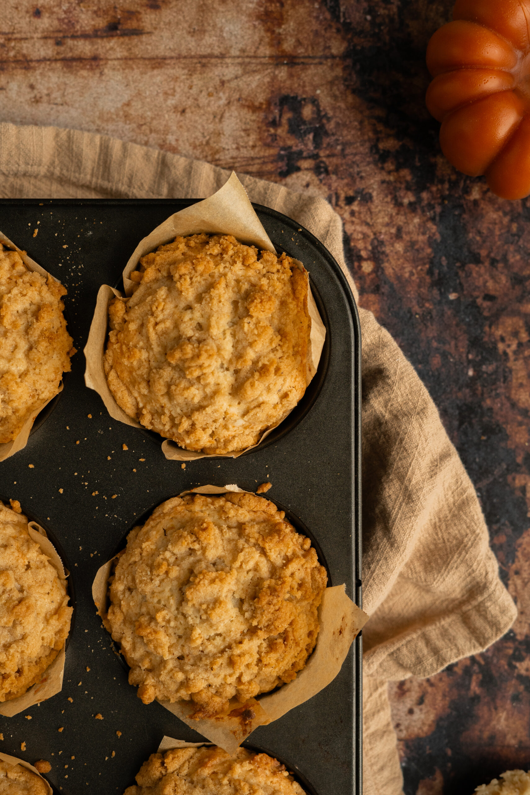 apple muffins in baking tin.