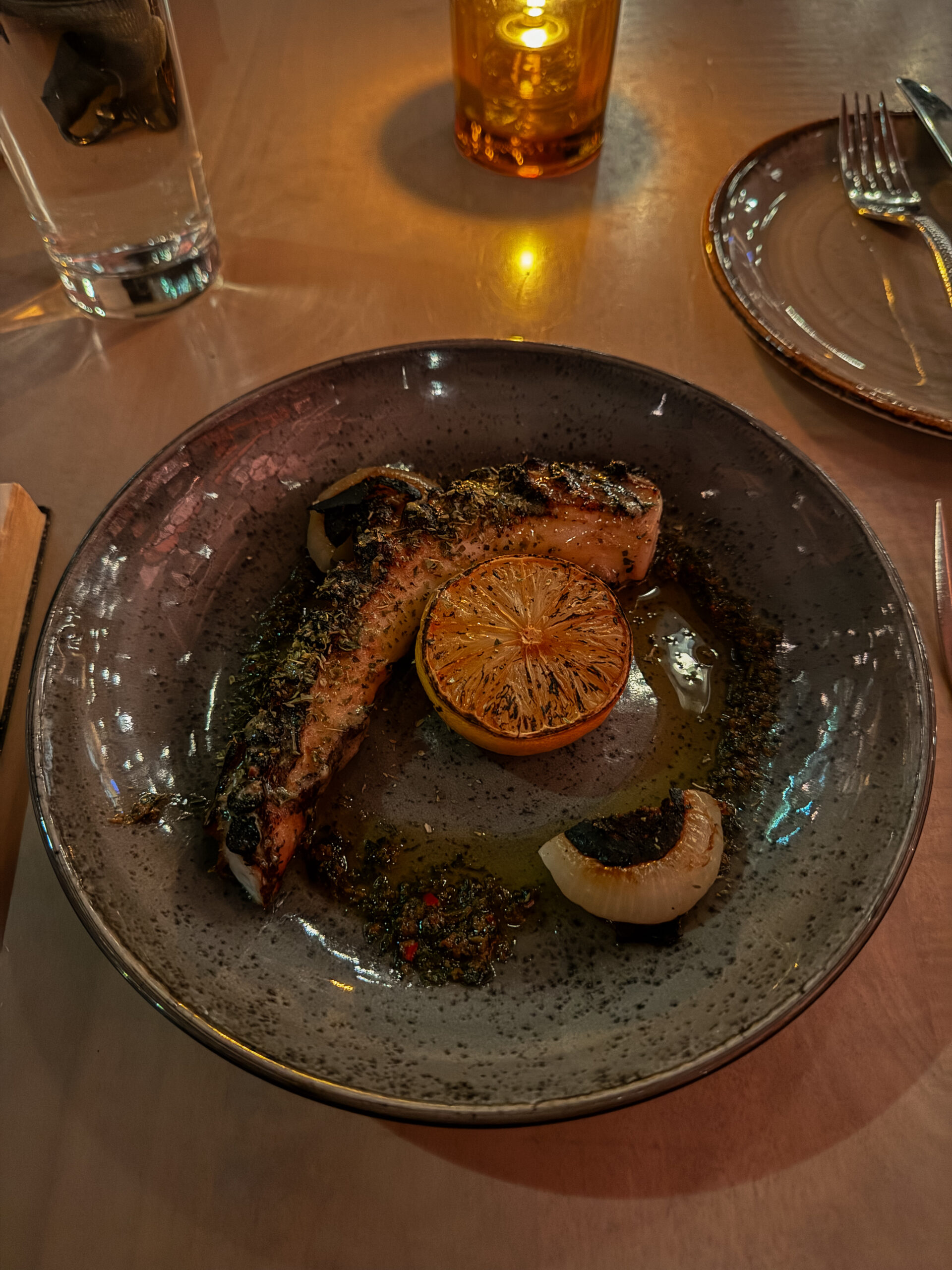 charred octopus on plate.