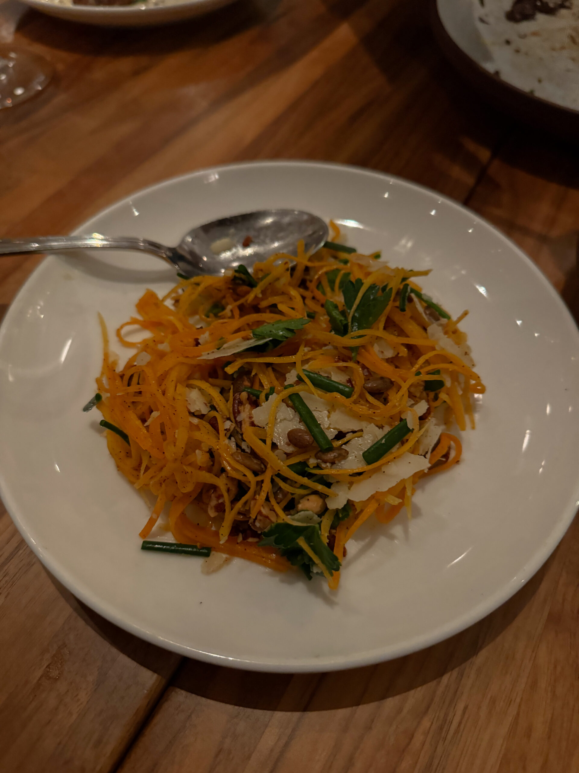 shaved squash salad on plate.