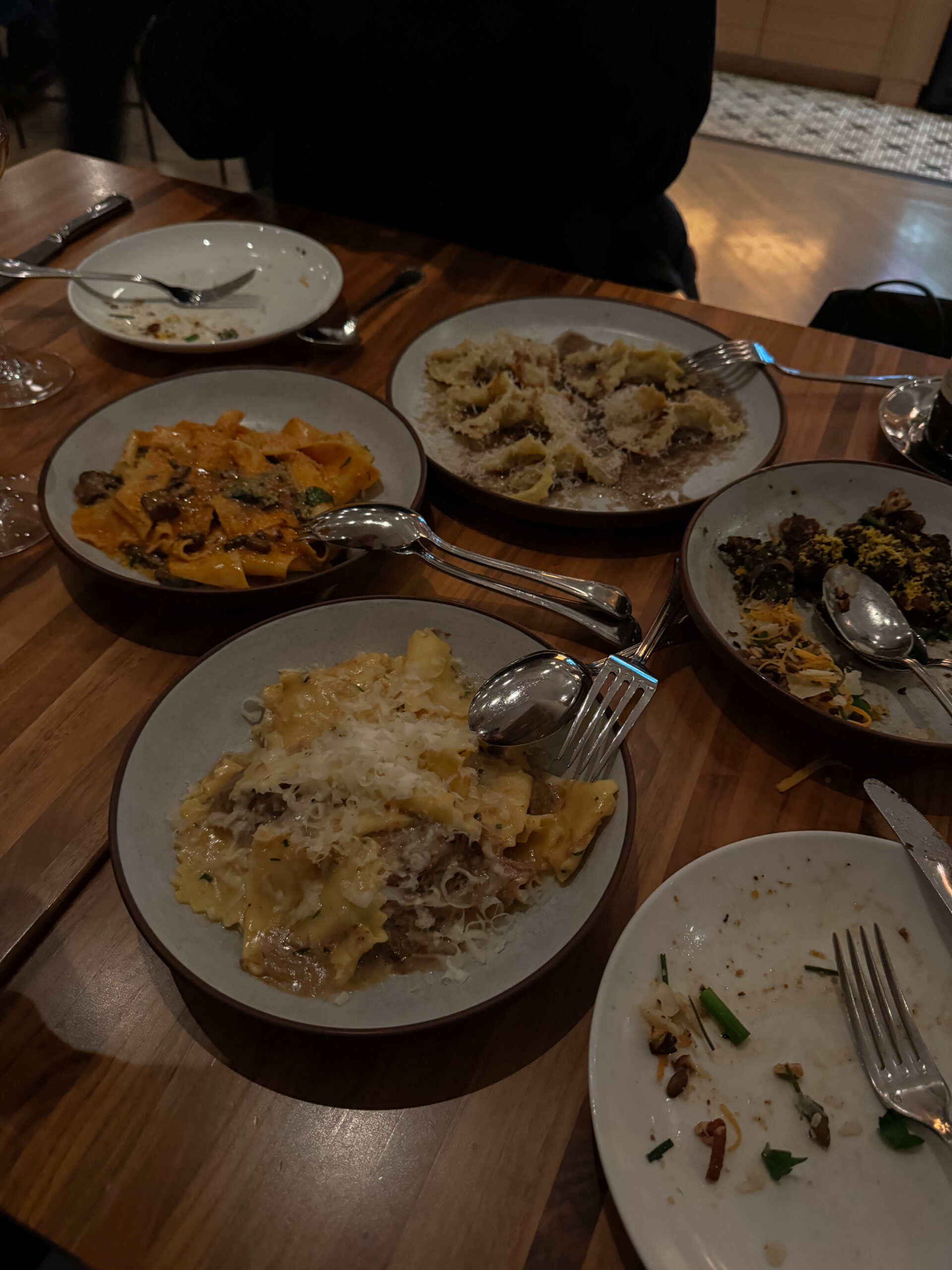 plates of pasta on table.