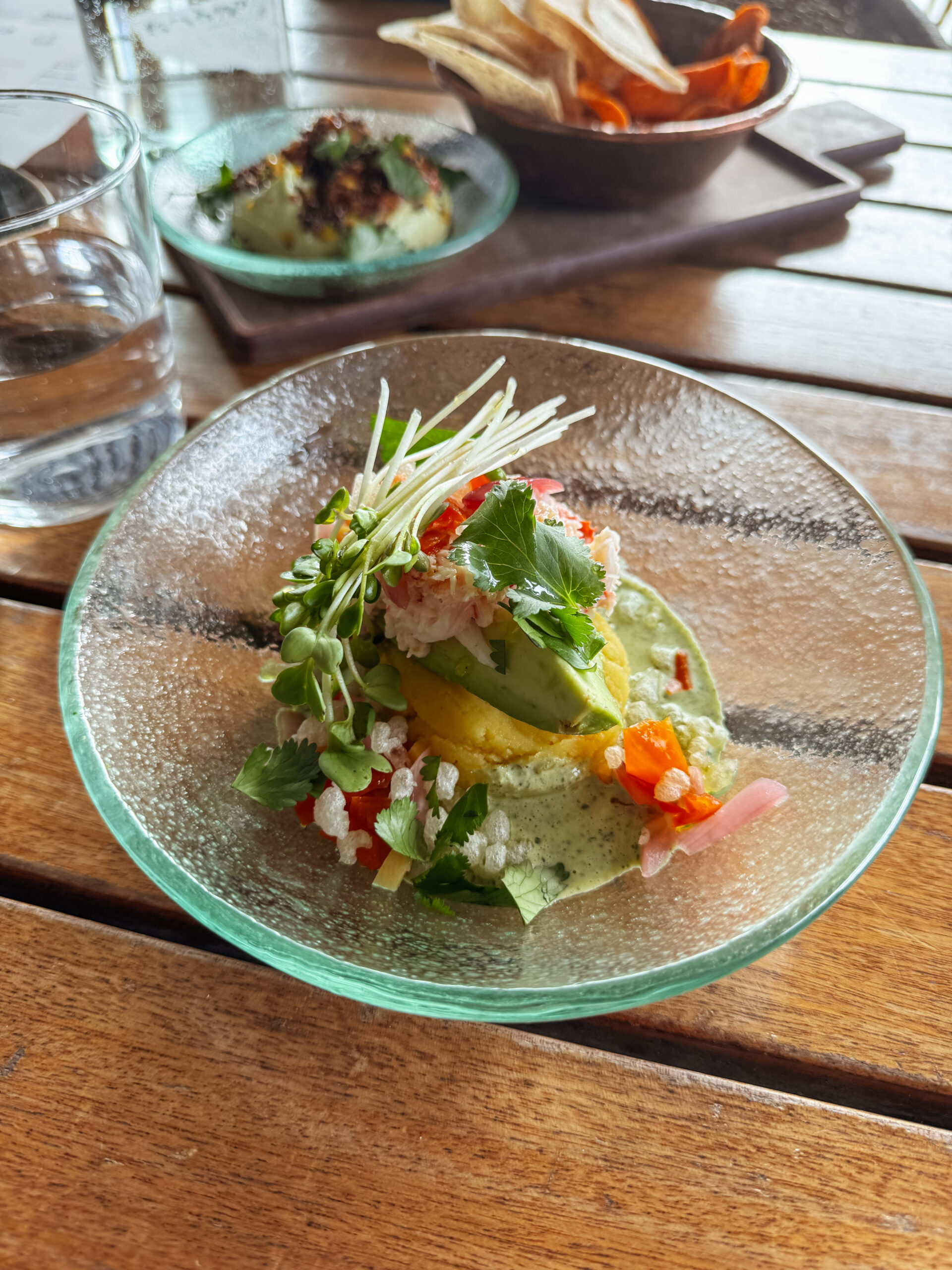 crab causa in glass bowl.