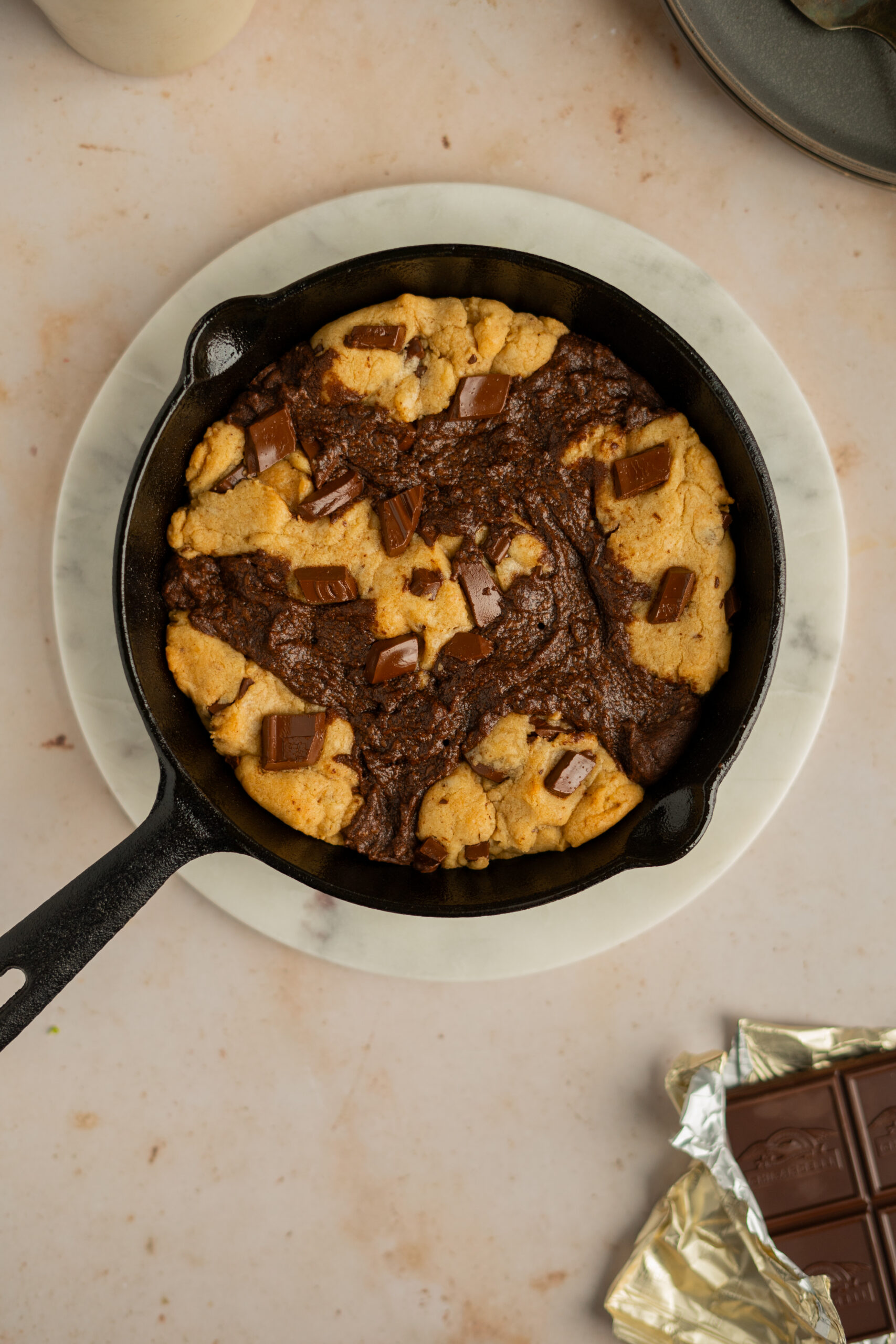 close up of brownie skillet cookie on beige background.