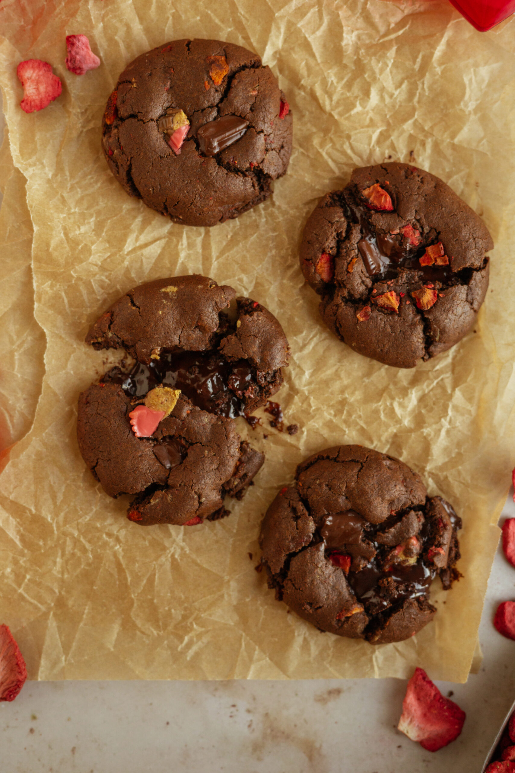 chocolate covered strawberry cookies on parchment paper.