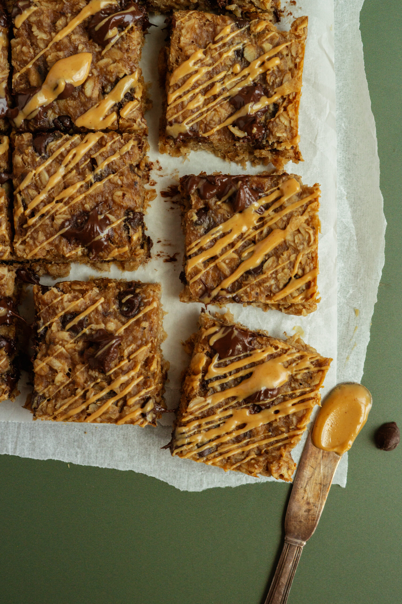 banana oat bars on white parchment paper.