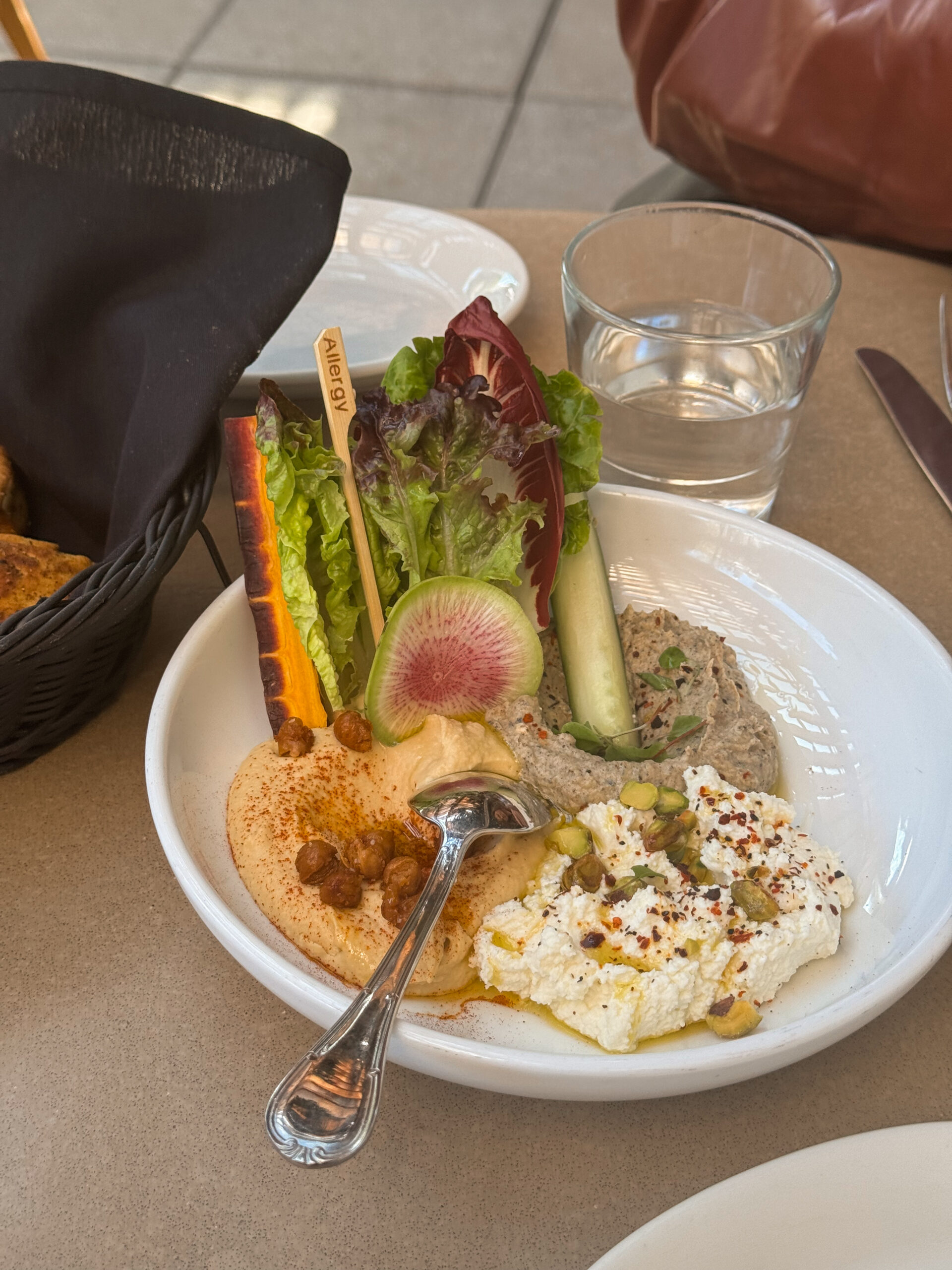 hummus spreads in white bowl.