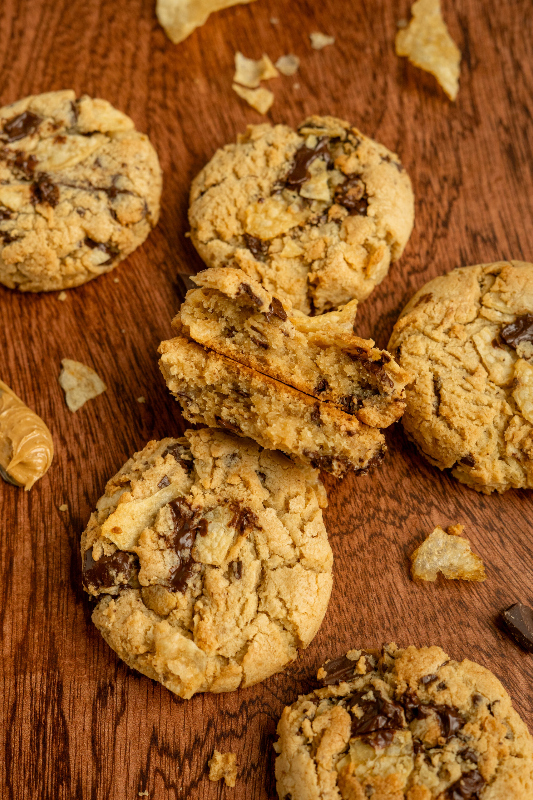 cross section of peanut butter chip cookie broken in half.