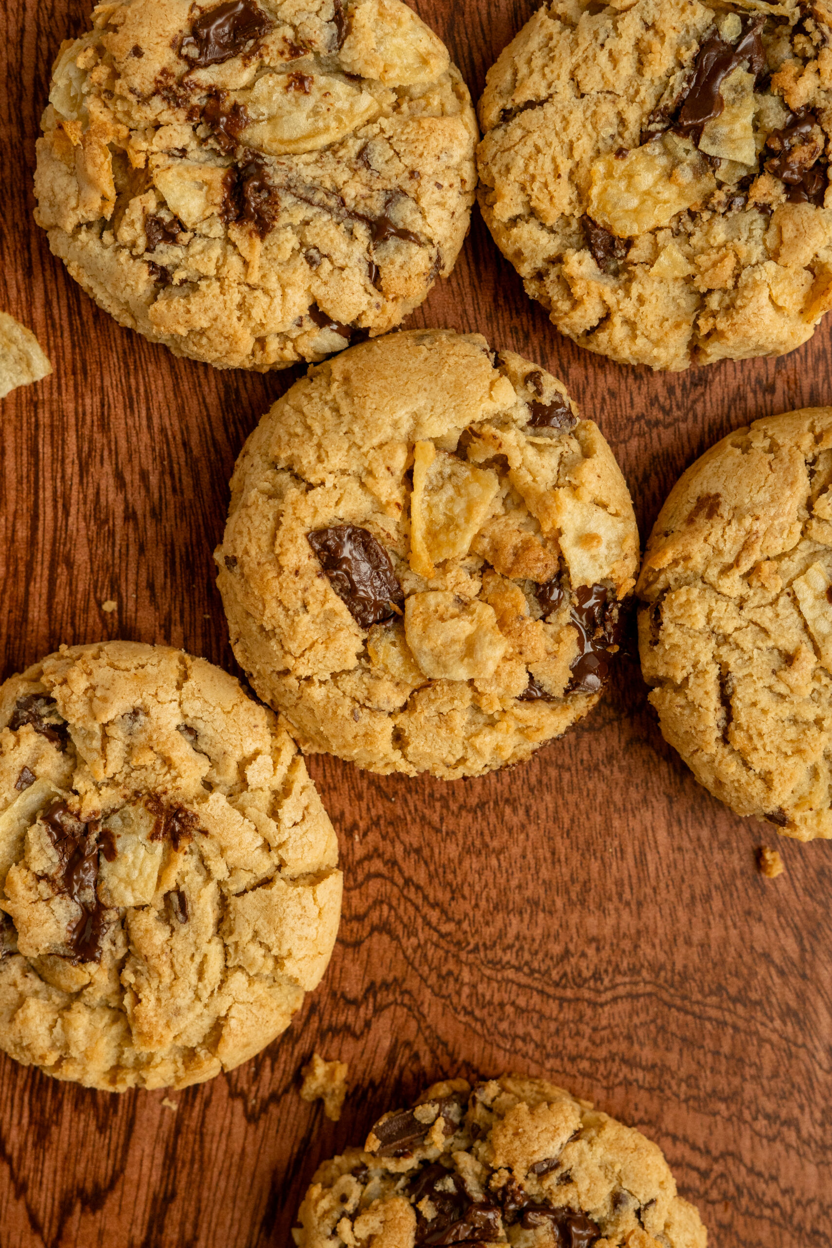 peanut butter chip cookies on wooden surface.