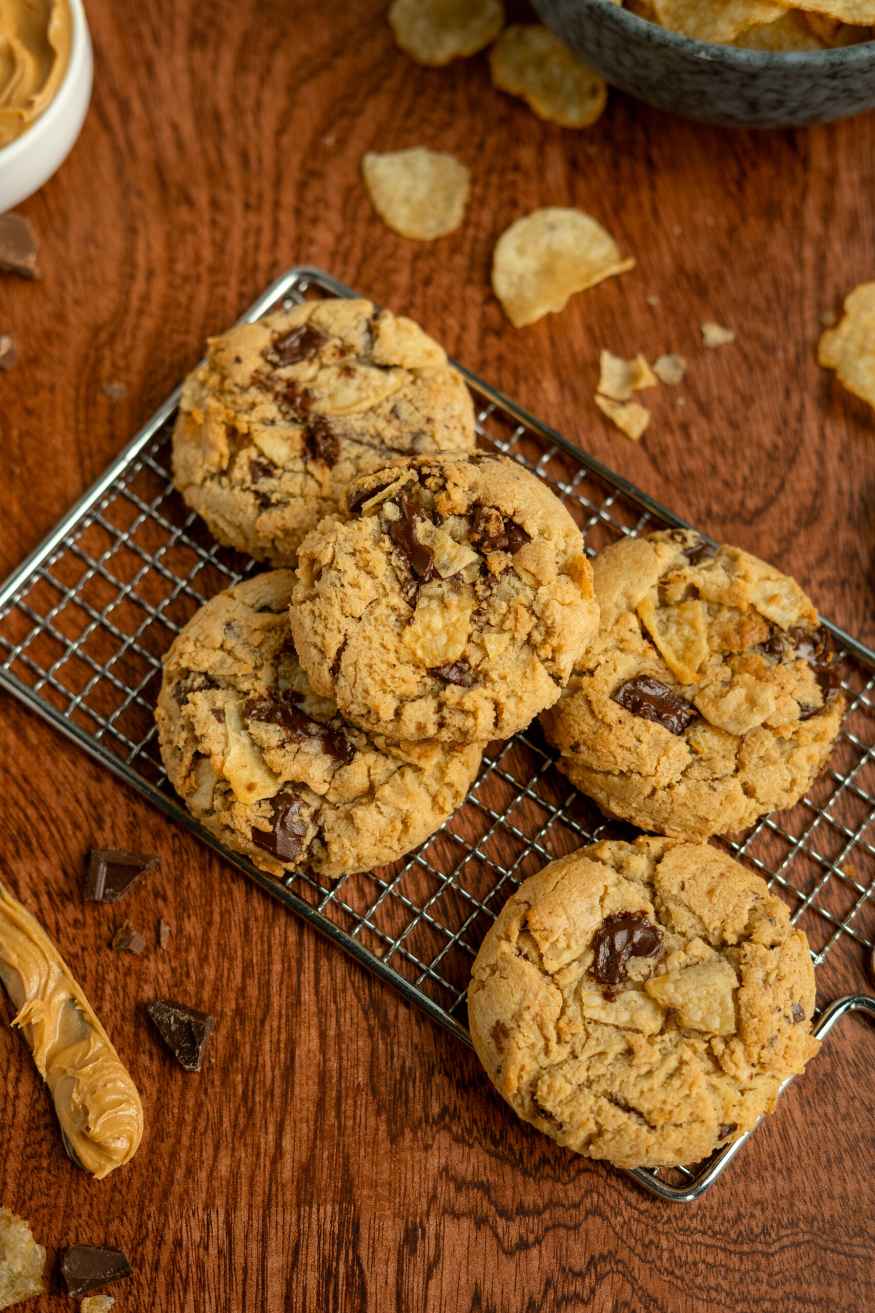 peanut butter chip cookies on a wire cooling tray.