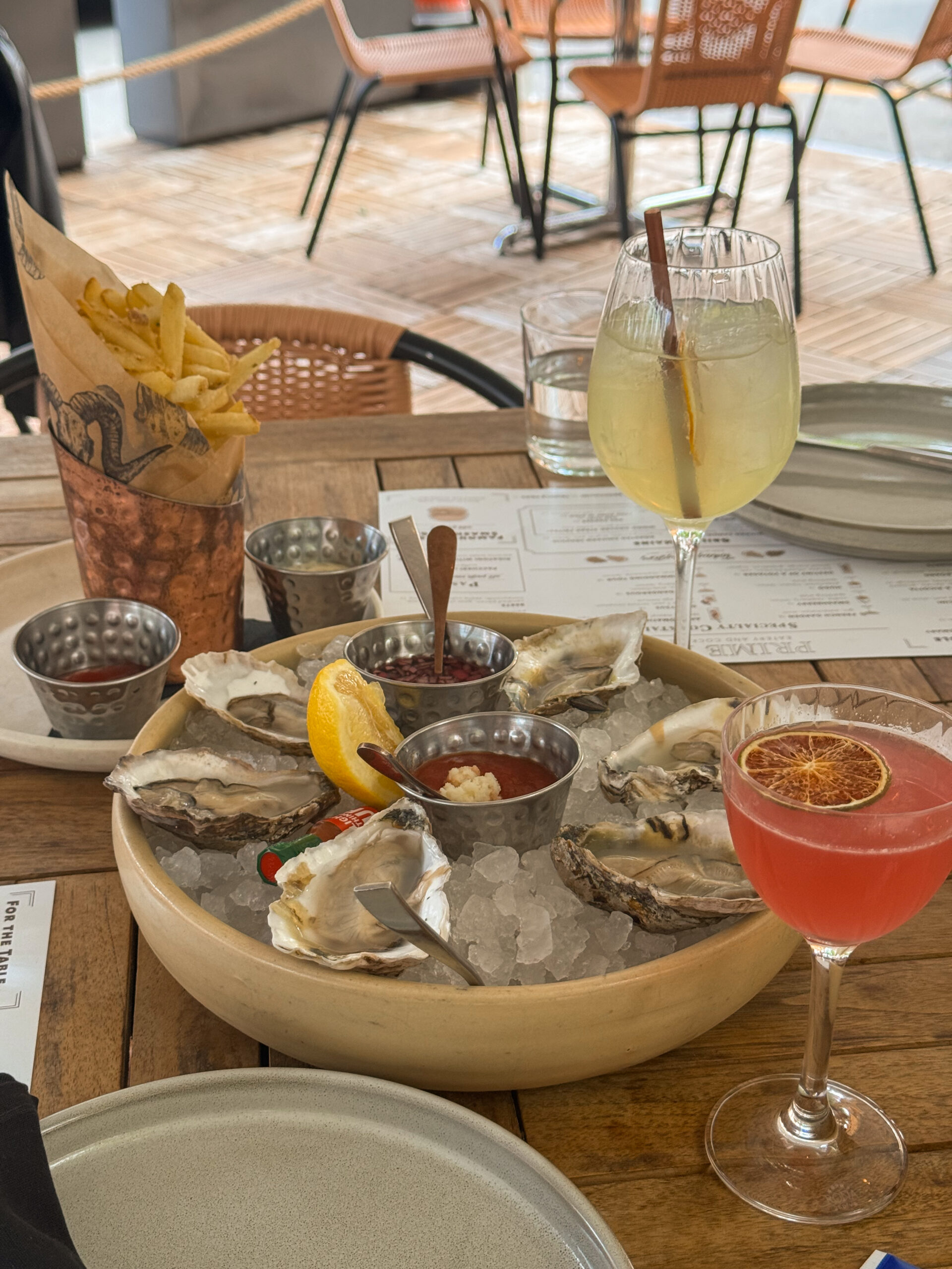 close up of oysters in ice bowl.