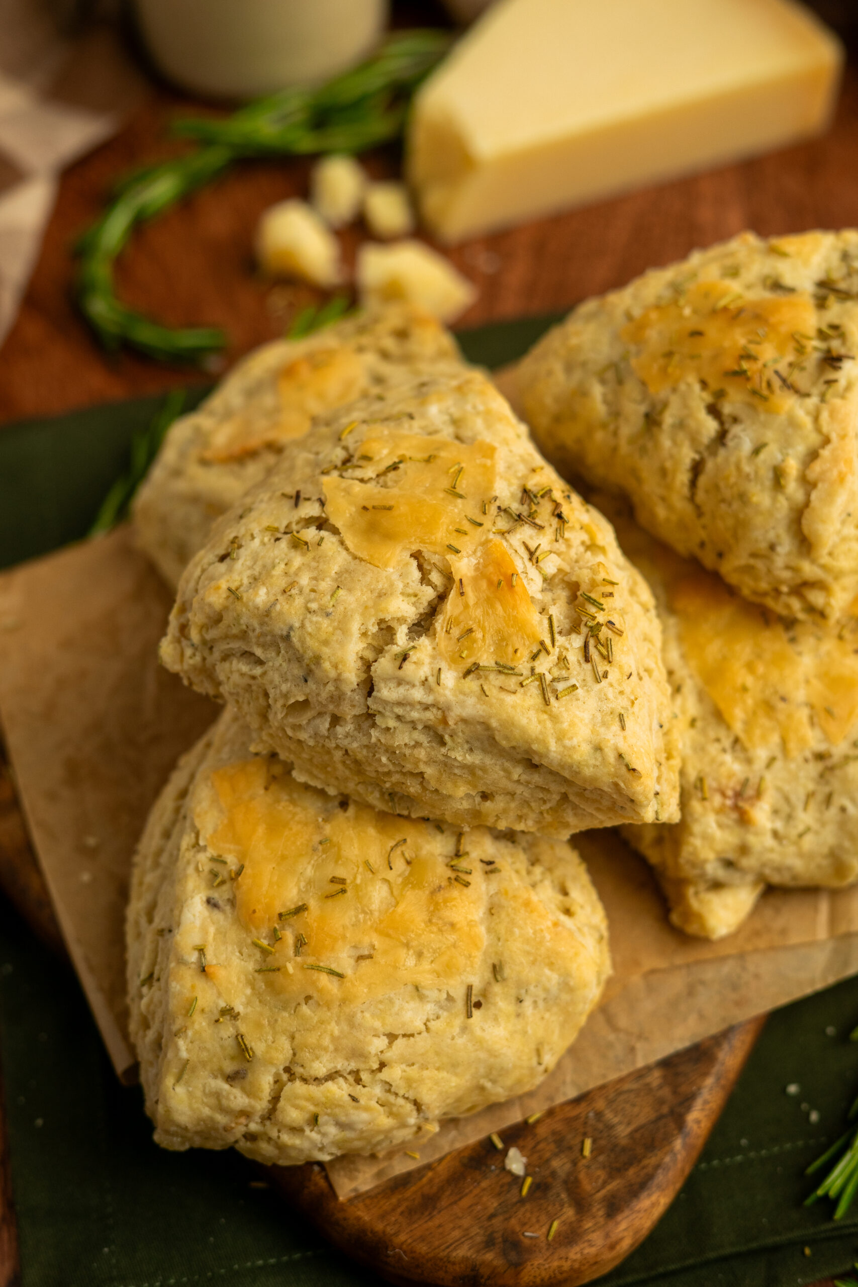 close up of parmesan garlic scones stacked in a pile.