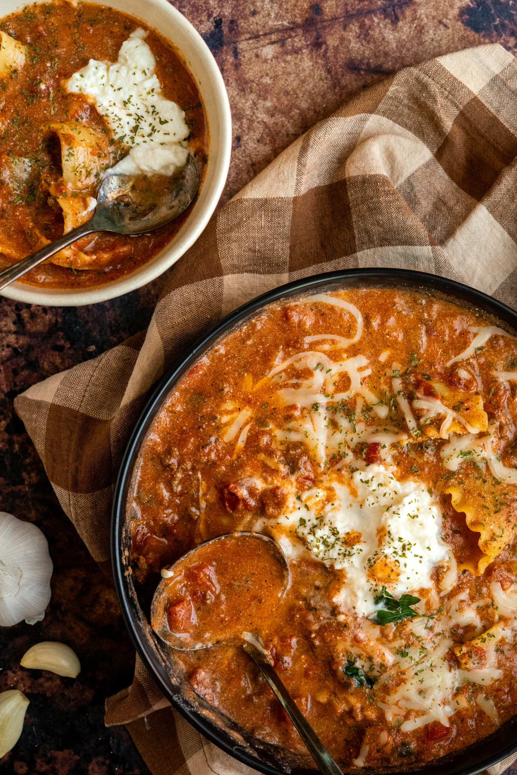 lasagna soup in large bowl with a small bowl of soup next to it.