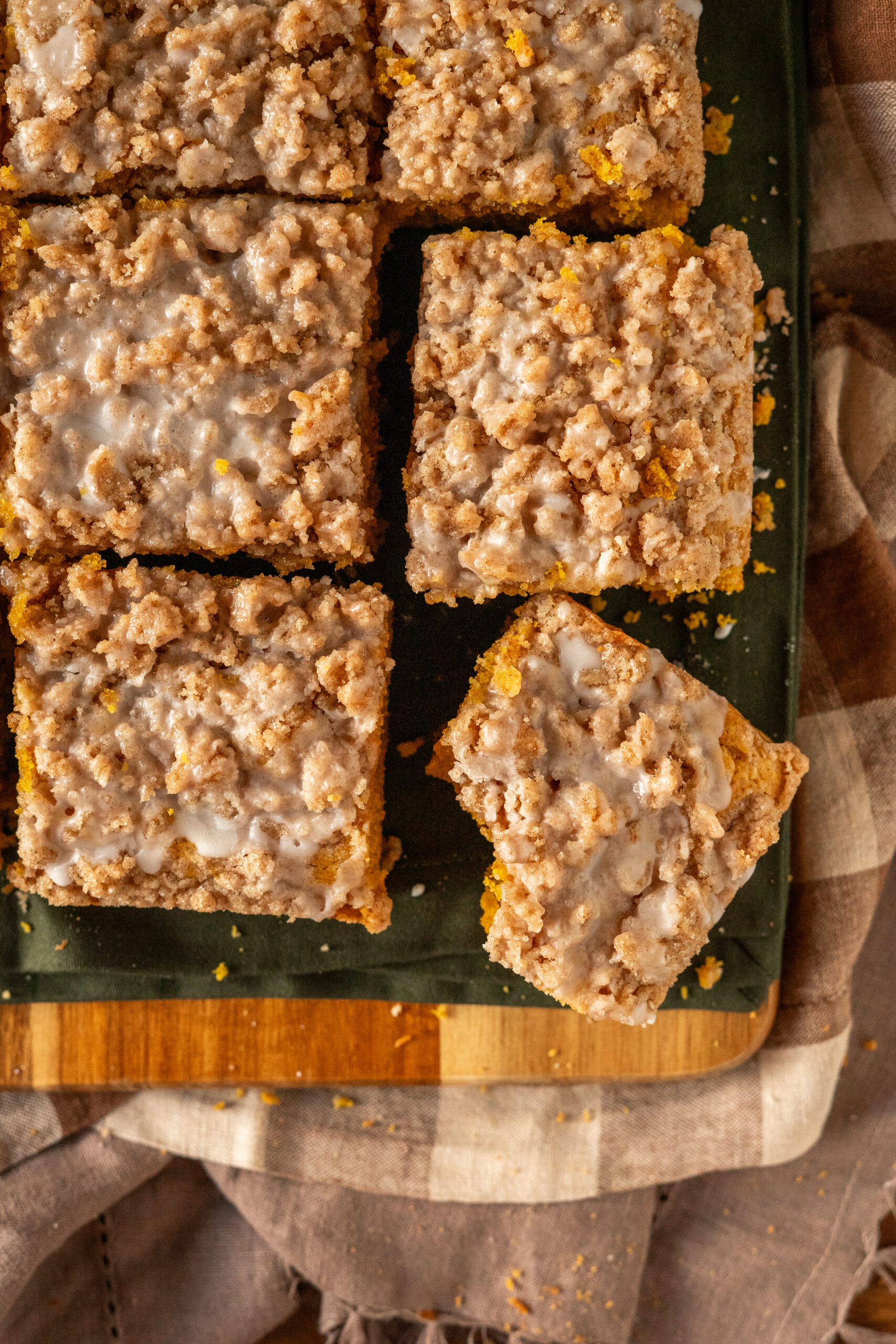 overhead view of pumpkin coffee cake sliced into squares.