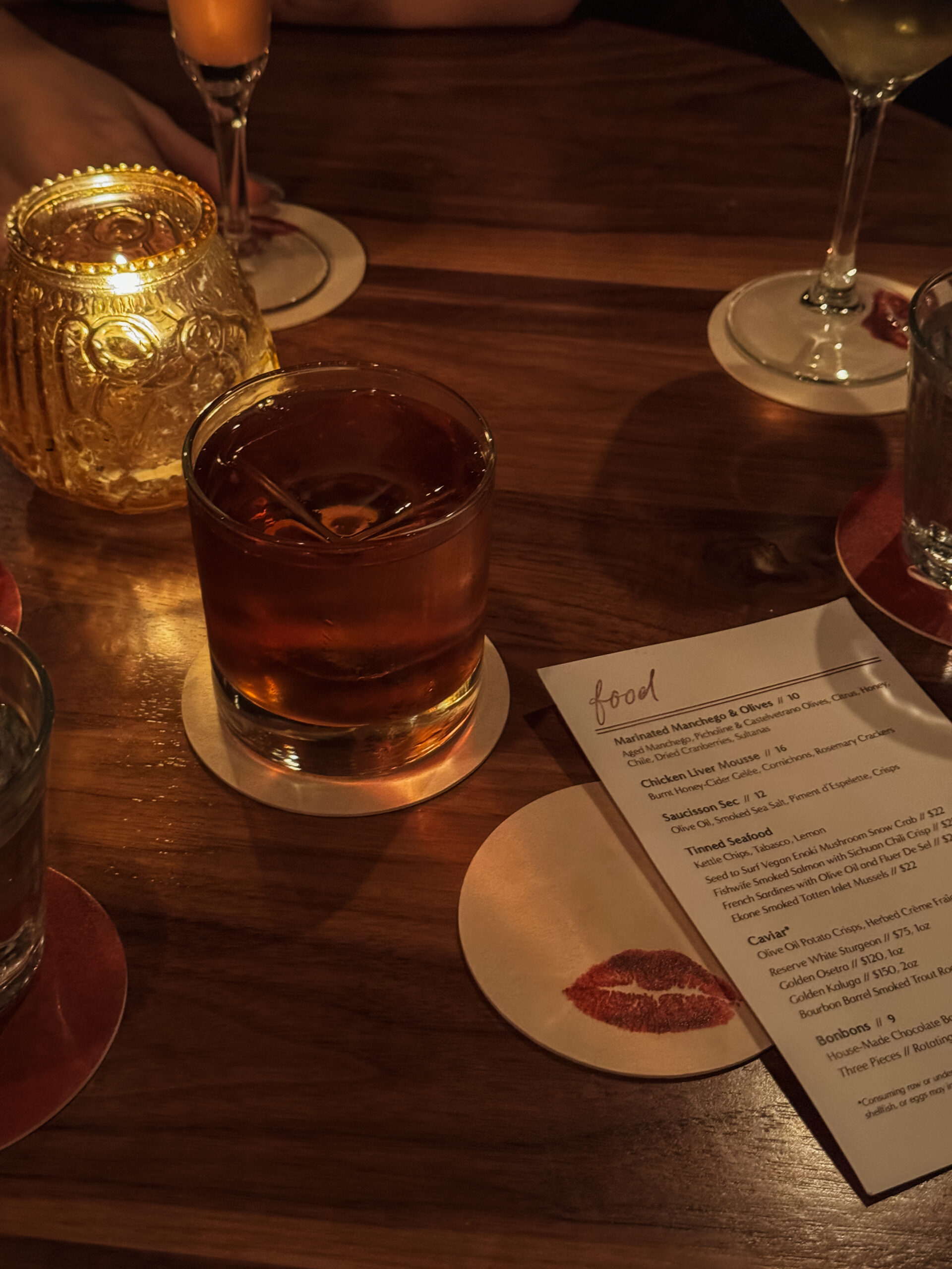 cocktails on table in dark room.