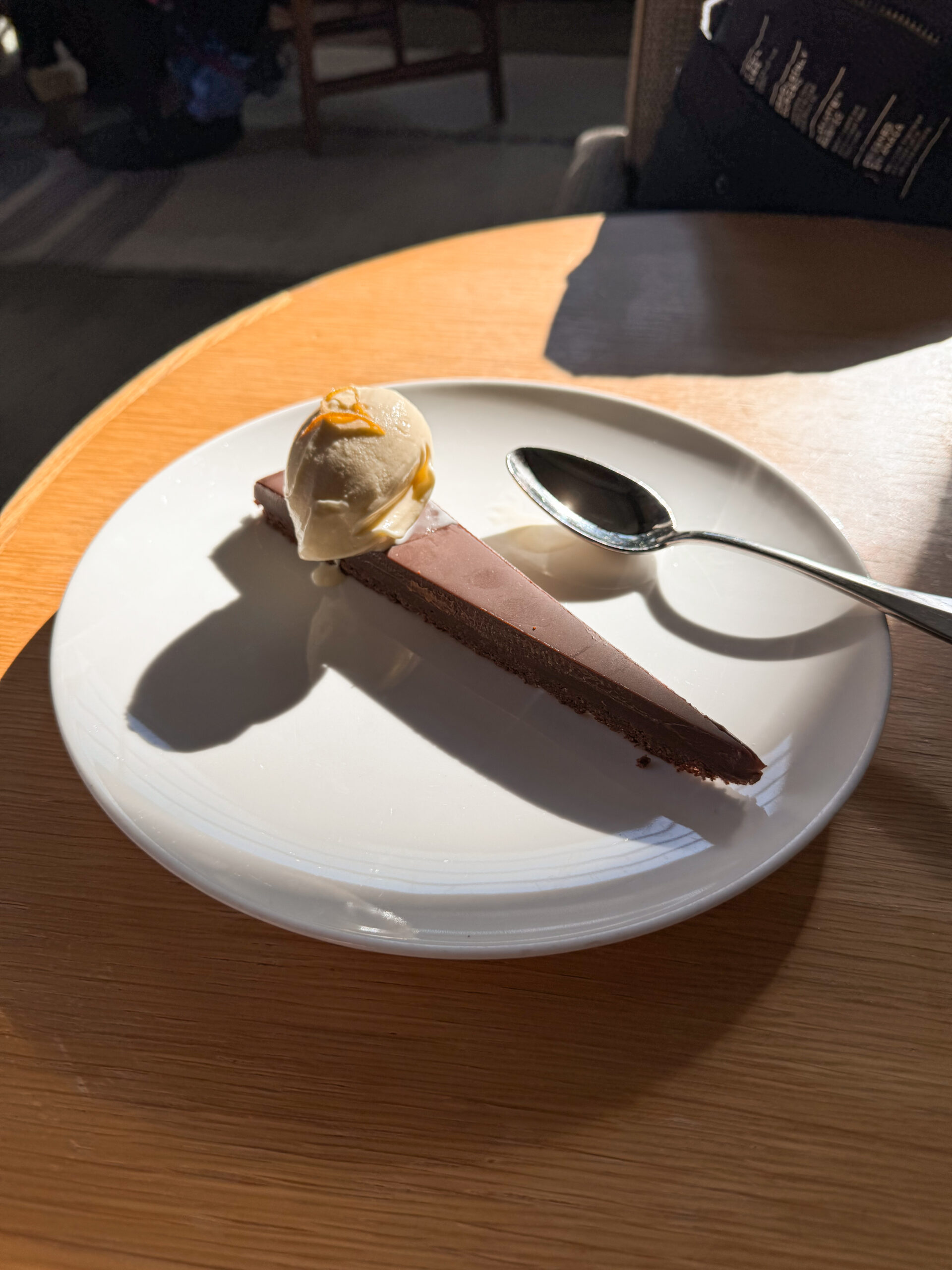 chocolate tart on white plate.