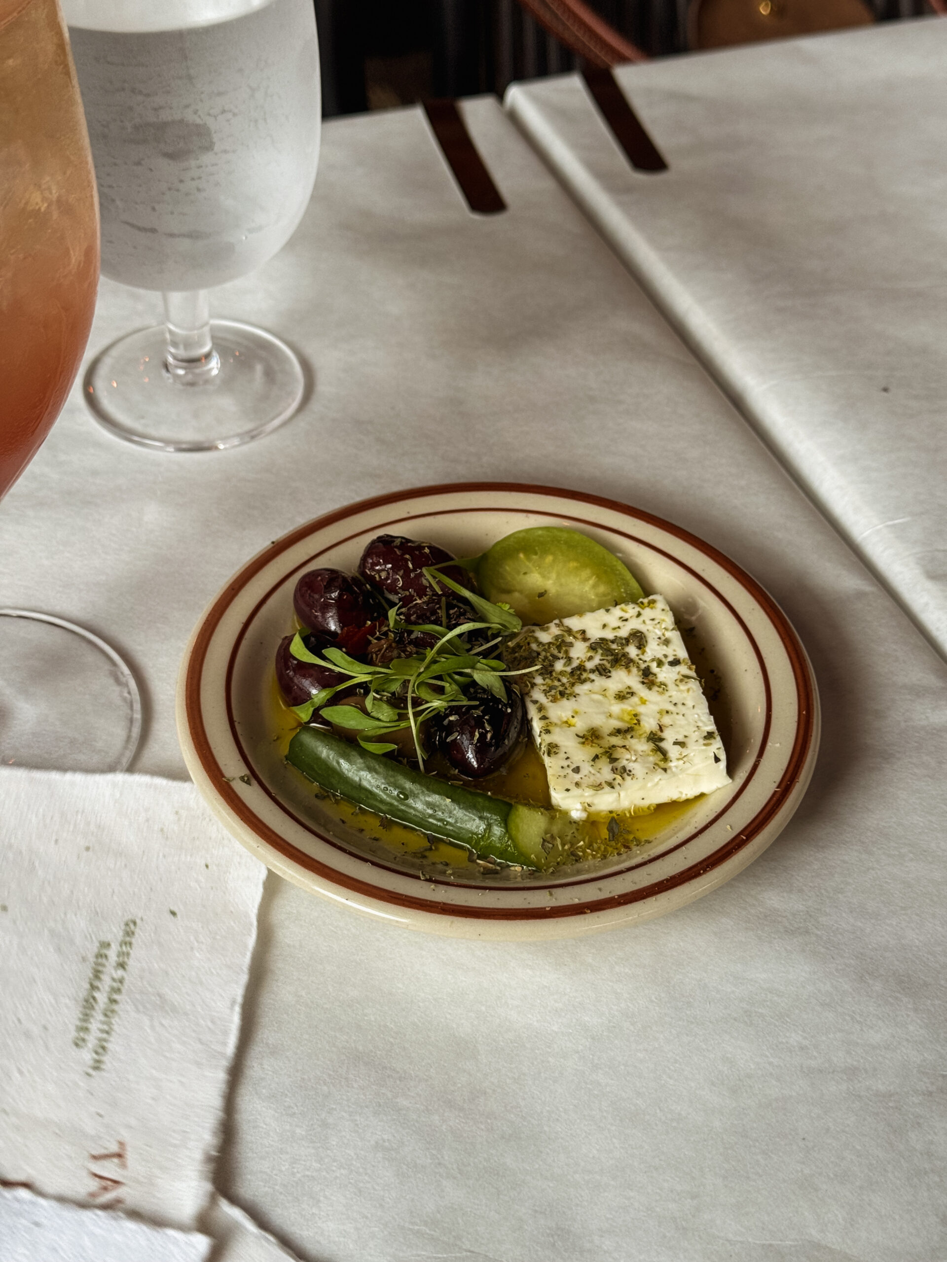 feta and cucumbers on small plate.