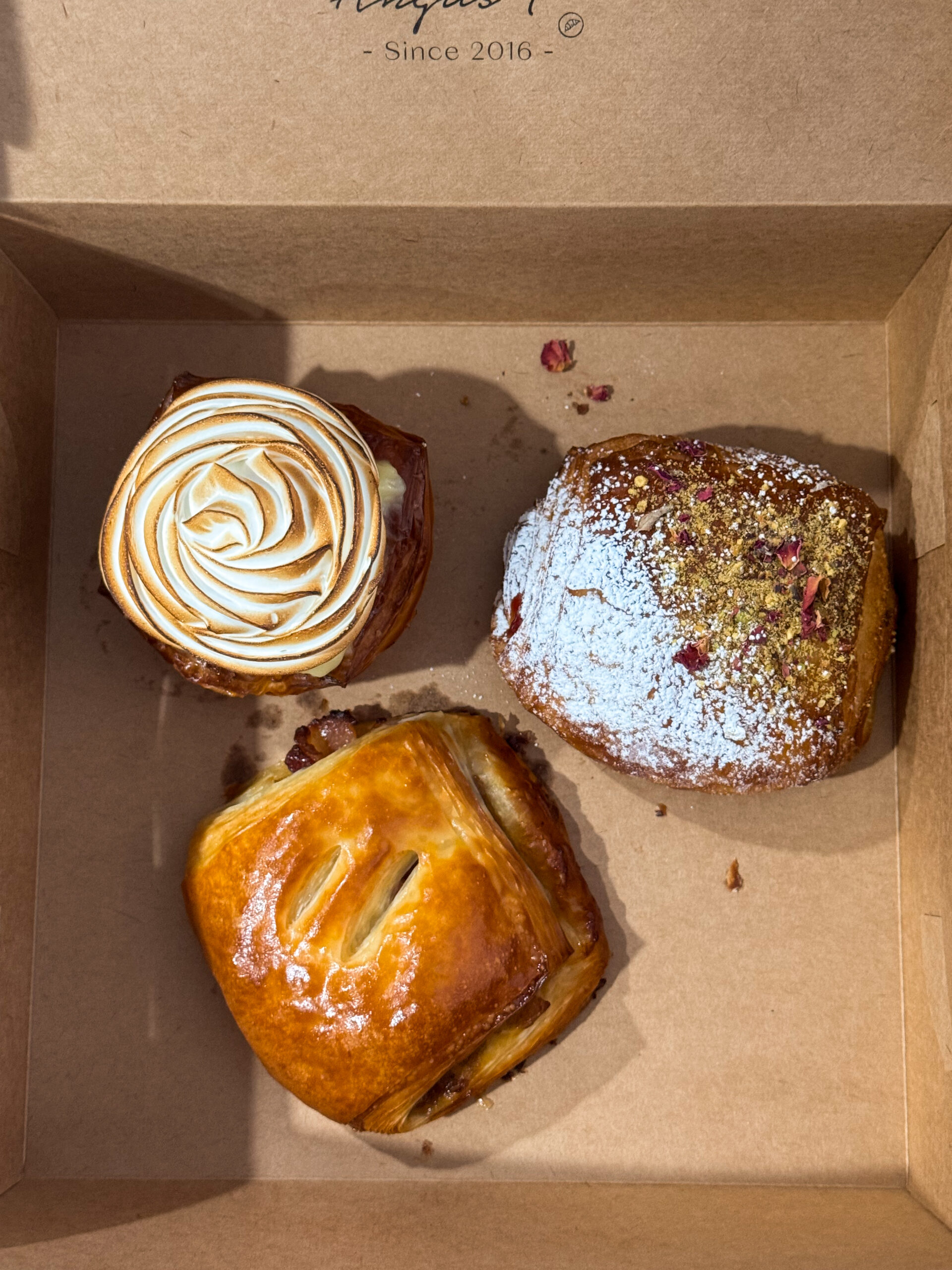 overhead view of pastries in box.