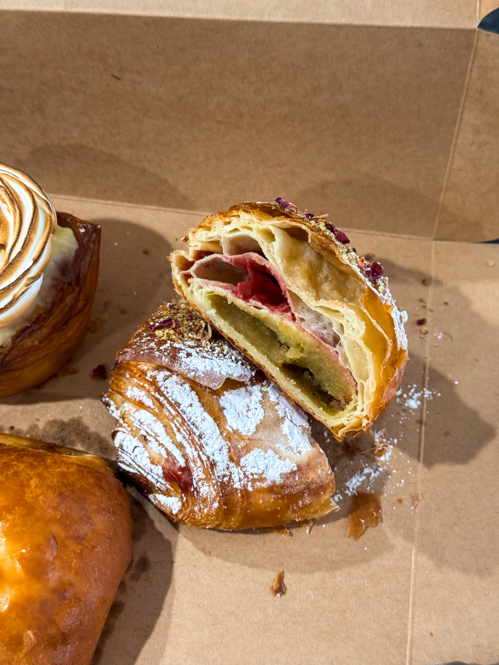 croissant sliced open in box.
