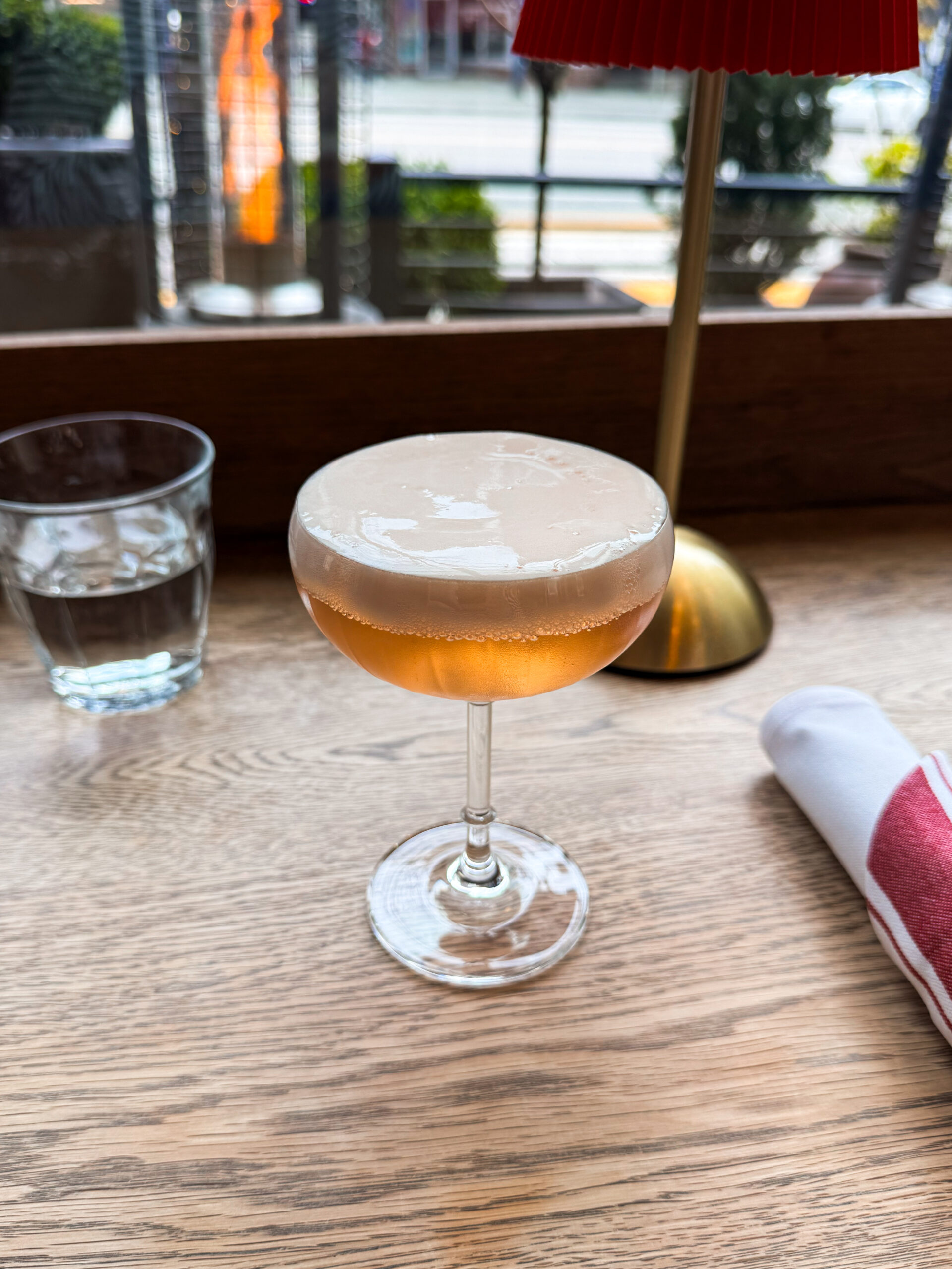 mimosa cocktail on wooden table.