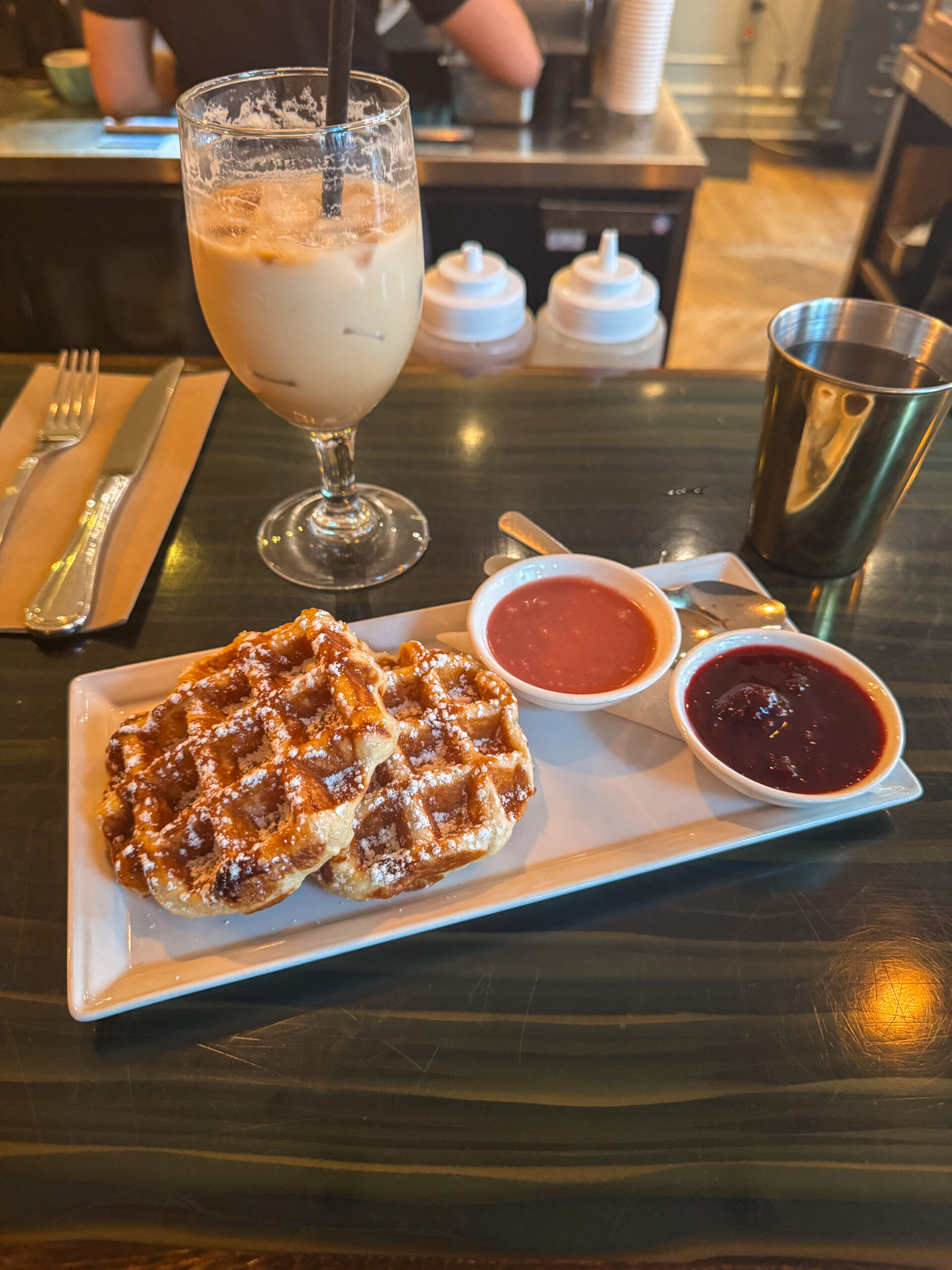 waffles and sauce on white plate.