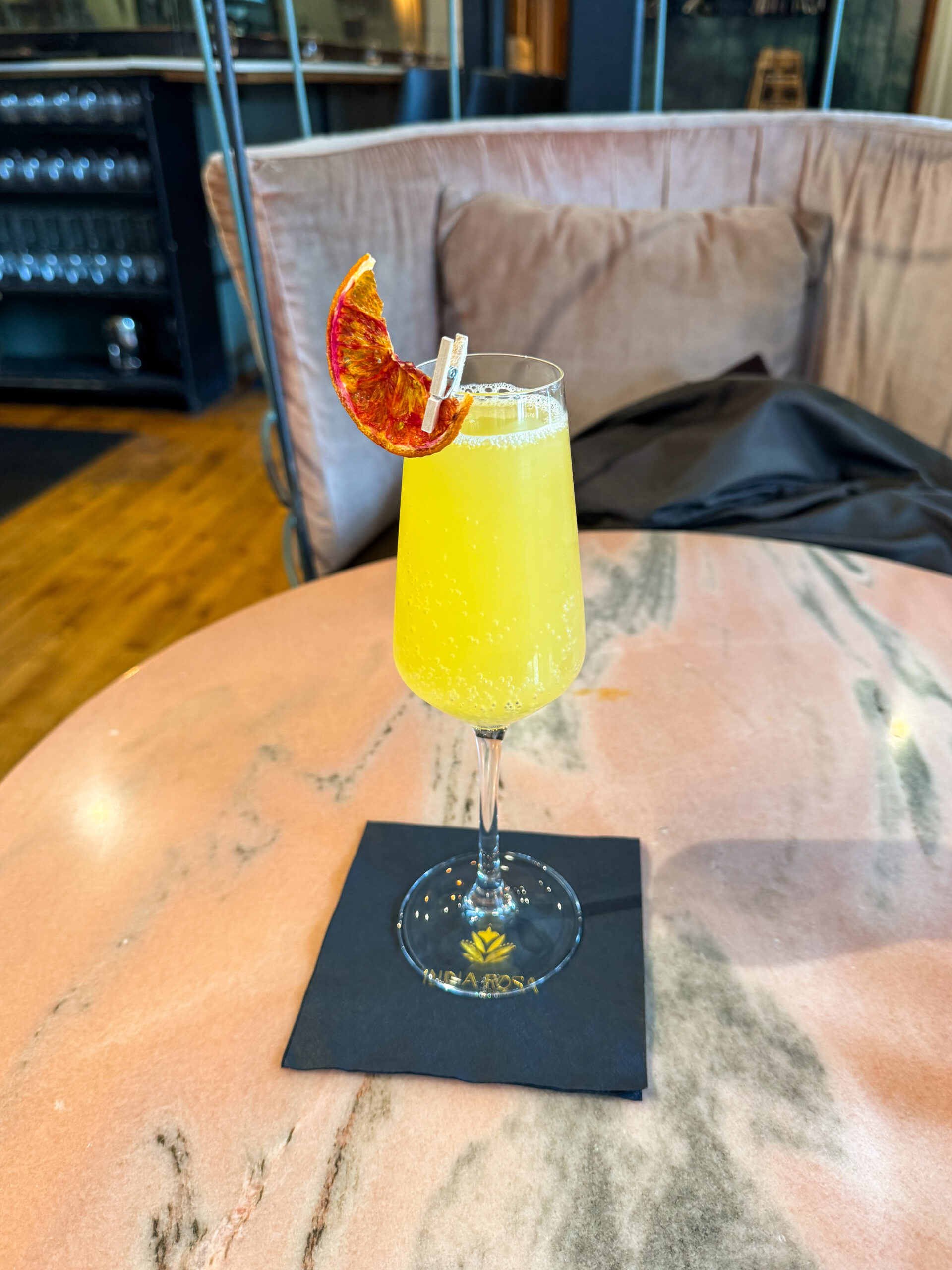 mimosa with dried orange garnish.