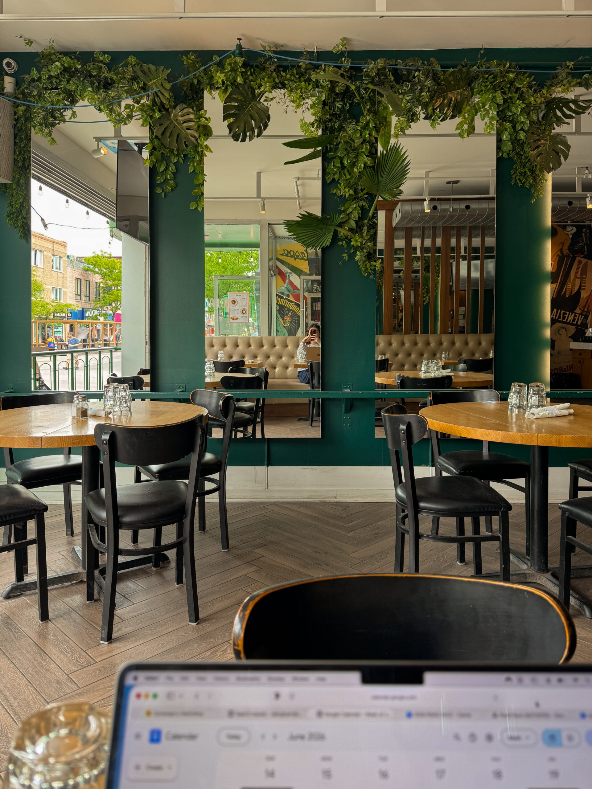 restaurant interior with mirrors and windows.