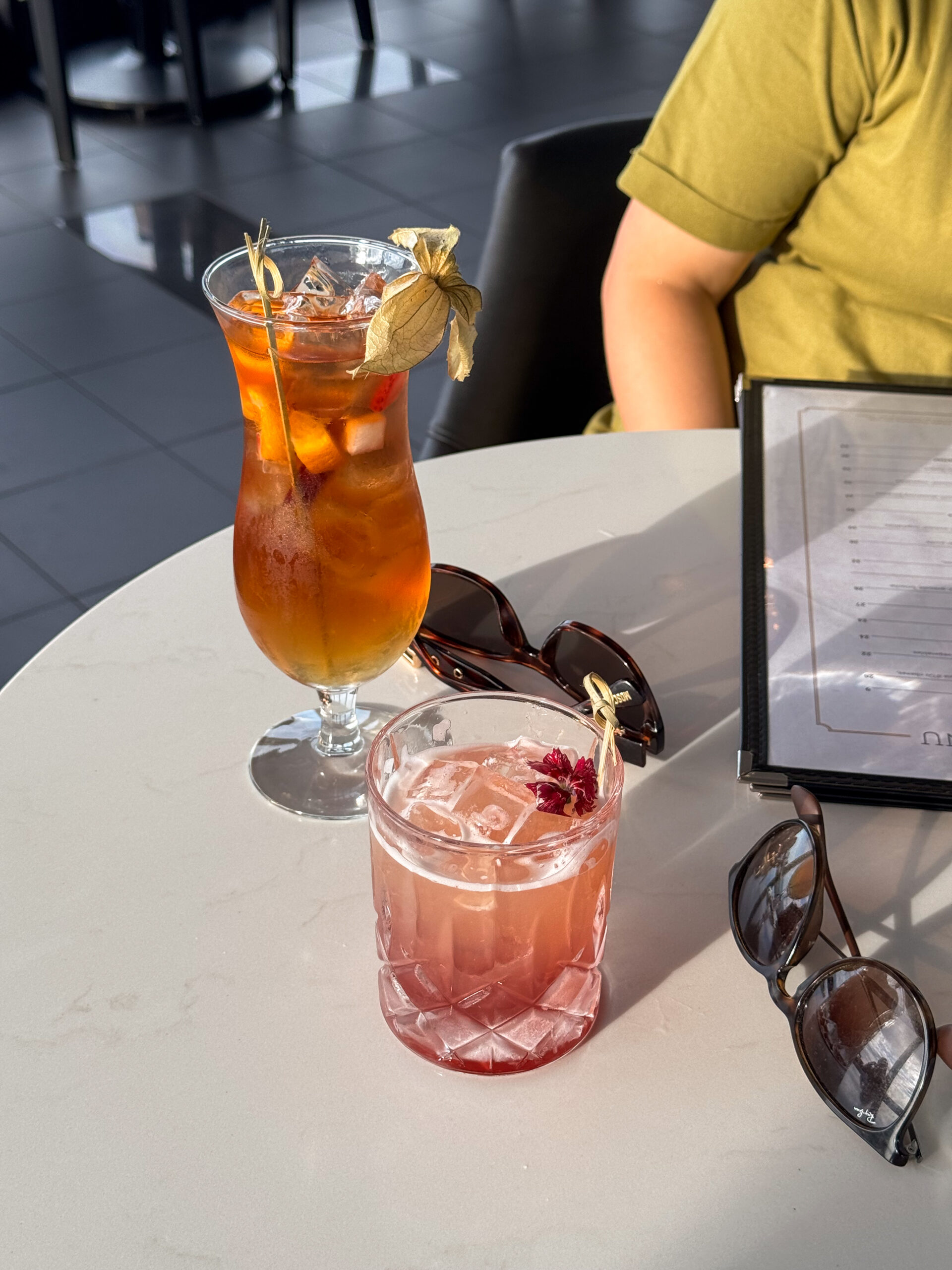 drinks on table with light shining.