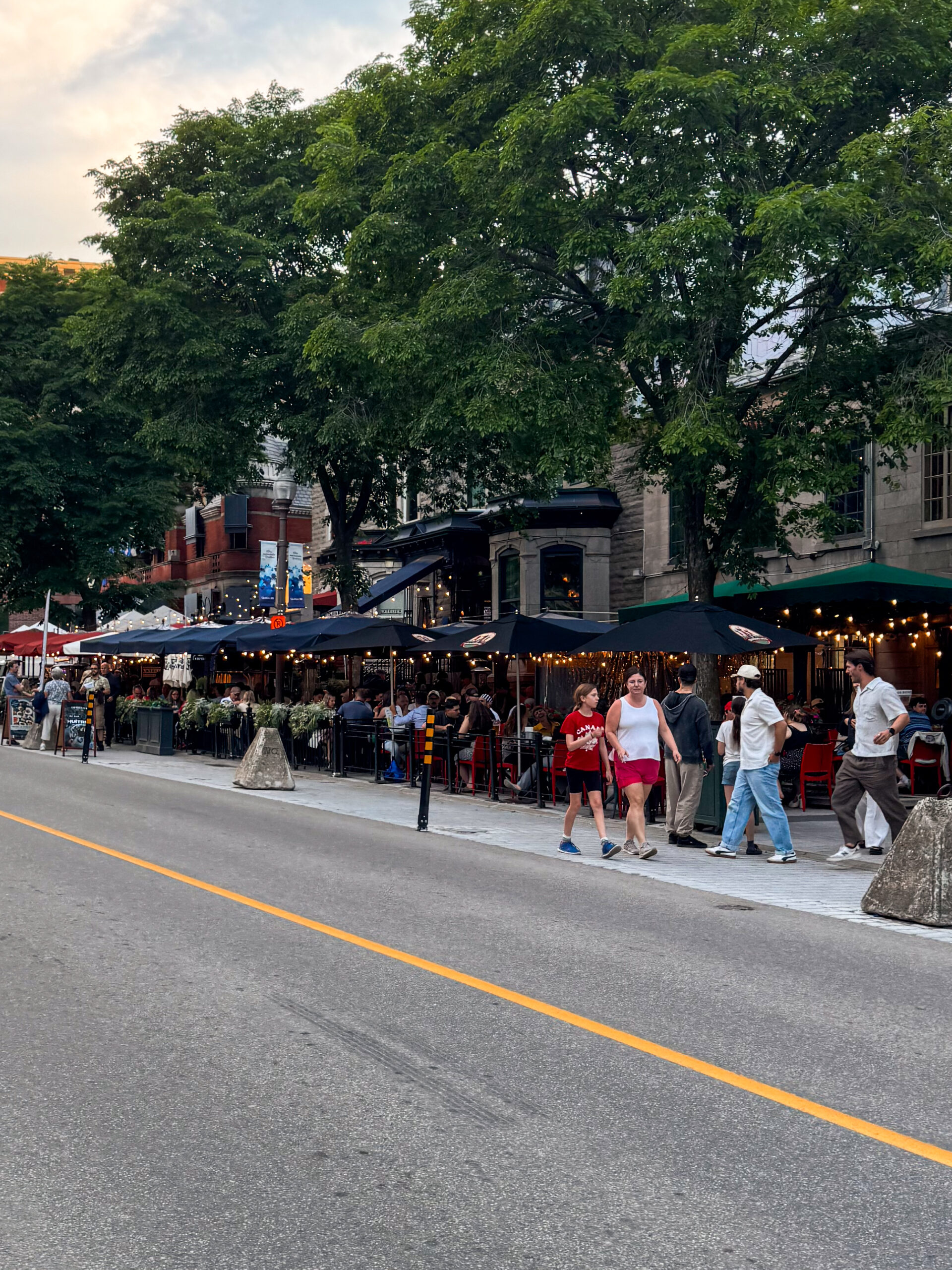 street view of Quebec City restaurants with twinkle lights.
