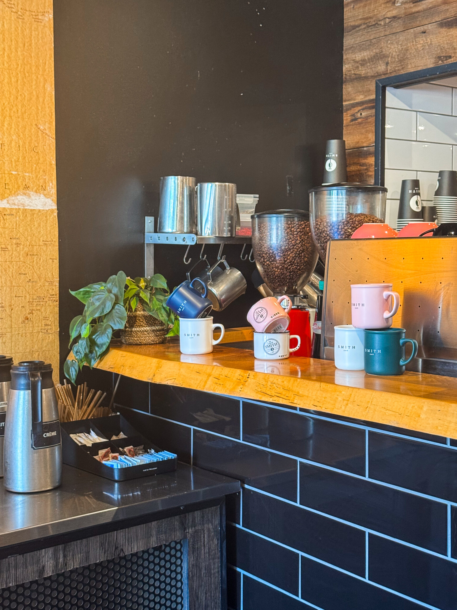 Quebec City cafe counter with mugs.